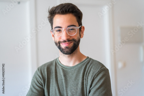 Young man smiling at home