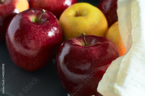 Bright red apples and yellow apples