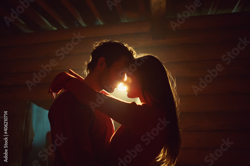 couple in love. Kissing man and woman at home in intimate atmosphere
