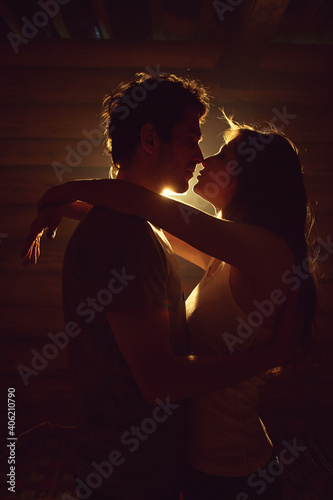 couple in love. Kissing man and woman at home in intimate atmosphere