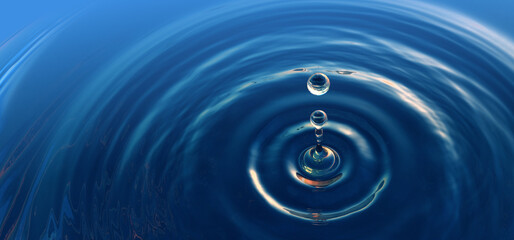 Clear blue water drop with rings and small waves.