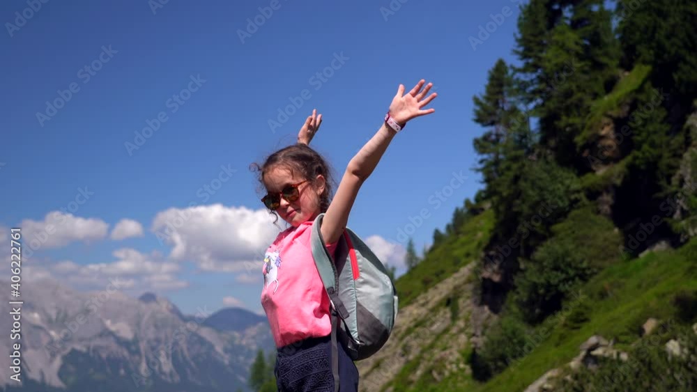 Children hiking on beautiful summer day in alps mountains Austria, resting on rock and admire amazing view to mountain peaks. Active family vacation leisure with kids. Outdoor fun and healthy activity Children hiking on beautiful summer day in alps mountains Austria, resting on rock and admire amazing view to mountain peaks. Active family vacation leisure with kids. Outdoor fun and healthy activity