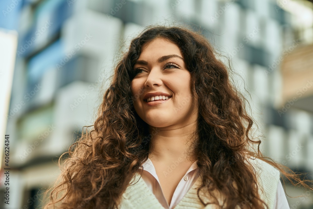 Young hispanic woman smiling happy standing at the city. Young hispanic woman smiling happy standing at the city.