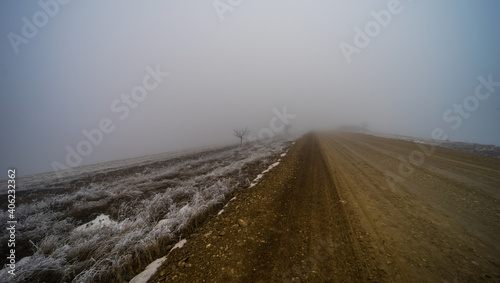 Road in a foggy landscape