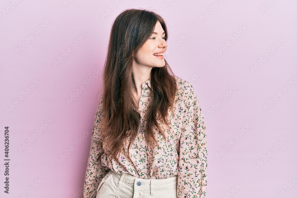 Fototapeta premium Young beautiful caucasian girl wearing elegant clothes looking away to side with smile on face, natural expression. laughing confident.