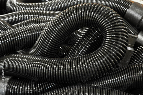 Wallpaper Mural Industrial image of commercial heavy duty vacuum suction hoses in a large bin Torontodigital.ca