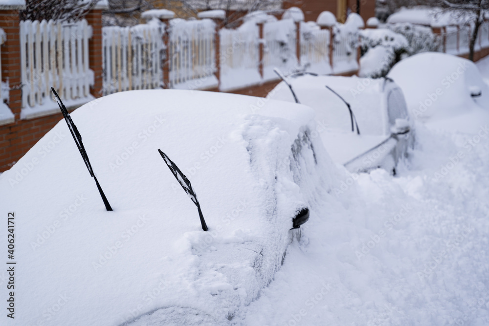 Parked cars covered of snow in Madrid