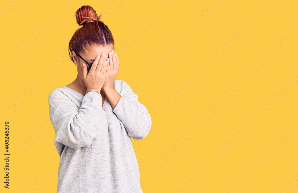 Young latin woman wearing casual clothes with sad expression covering face with hands while crying. depression concept. Young latin woman wearing casual clothes with sad expression covering face with hands while crying. depression concept.