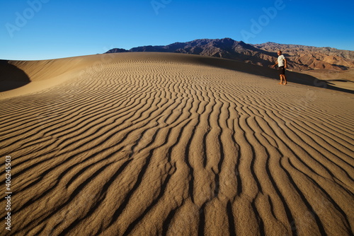 Walking on a sand dune