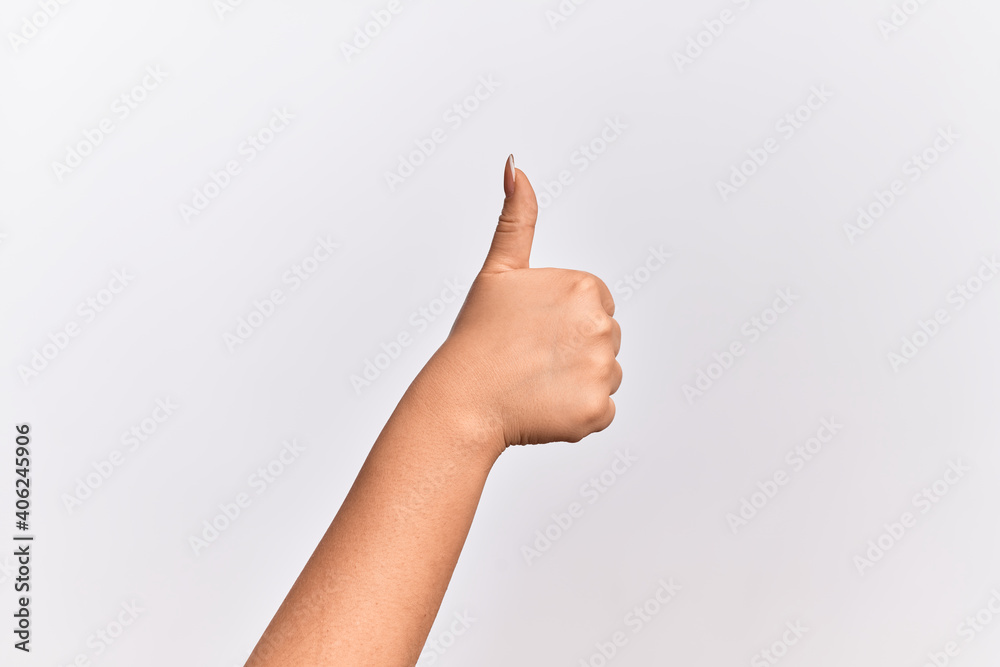 Hand of caucasian young woman doing successful approval gesture with thumbs up, validation and positive symbol Hand of caucasian young woman doing successful approval gesture with thumbs up, validation and positive symbol