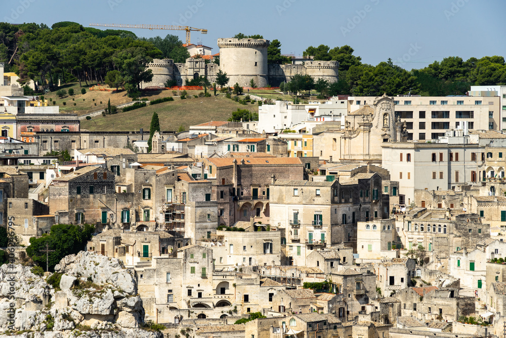 Sassi historic district in Matera with Tramontano castle on the top of the hill, Basilicata, Italy