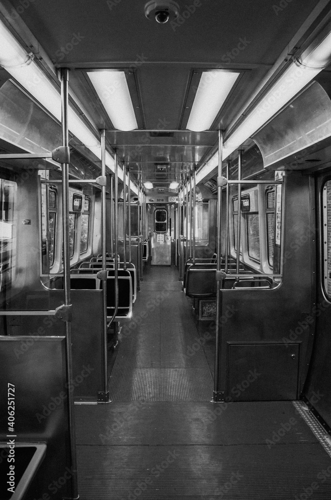 Black and white symmetrical picture of a train. Interior photo of a