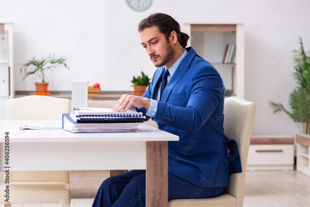 Young male employee in self-quarantine concept Young male employee in self-quarantine concept