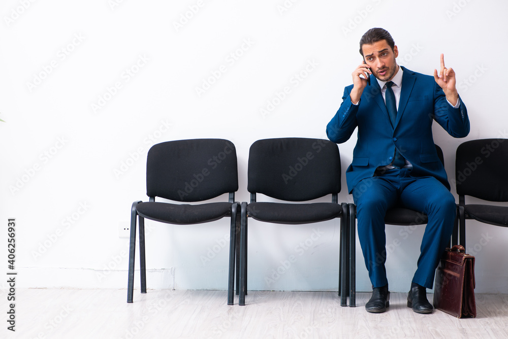 Young businessman waiting for an interview at hall Young businessman waiting for an interview at hall