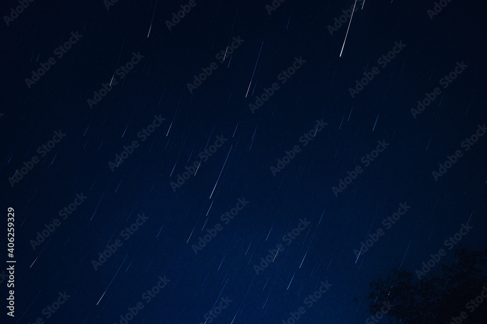 long exposure picture of stars moving in circular motion. looking like meteor shower