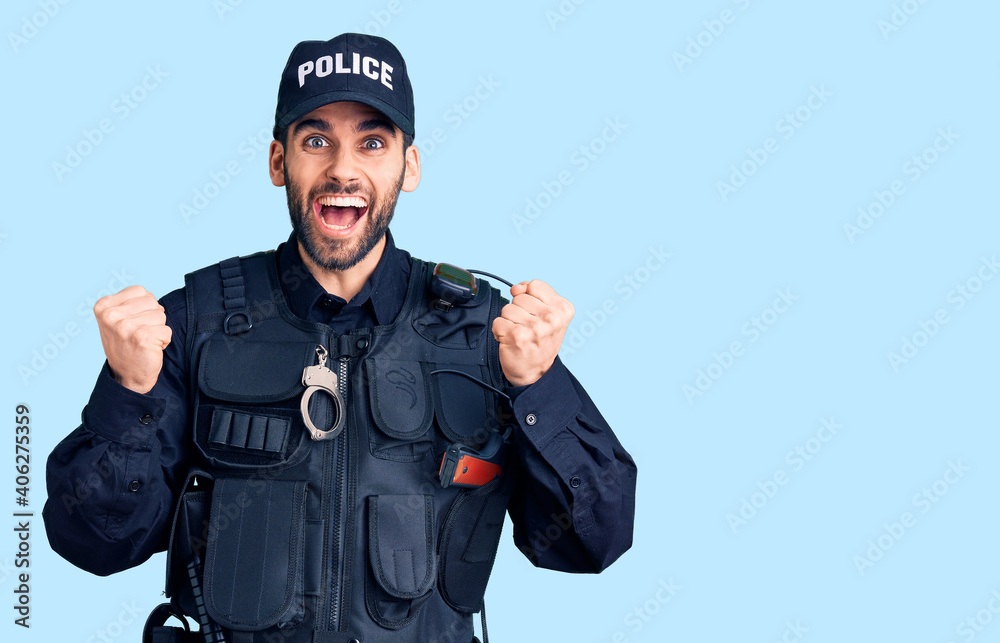 Young handsome man with beard wearing police uniform celebrating surprised and amazed for success with arms raised and open eyes. winner concept. Young handsome man with beard wearing police uniform celebrating surprised and amazed for success with arms raised and open eyes. winner concept.
