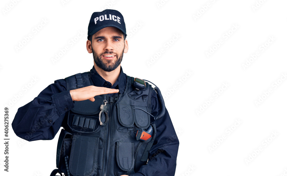 Young handsome man with beard wearing police uniform gesturing with hands showing big and large size sign, measure symbol. smiling looking at the camera. measuring concept. Young handsome man with beard wearing police uniform gesturing with hands showing big and large size sign, measure symbol. smiling looking at the camera. measuring concept.