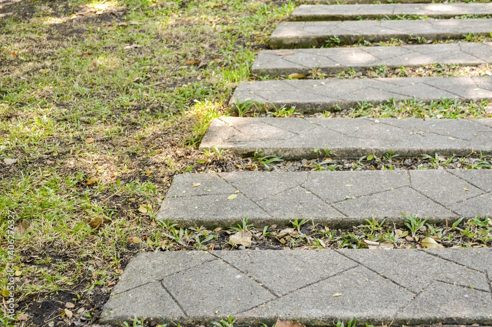 cement plate on green grass in nature garden cement plate on green grass in nature garden