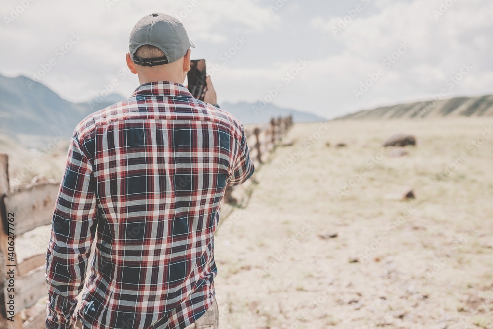 Men with mobile phone outdoors