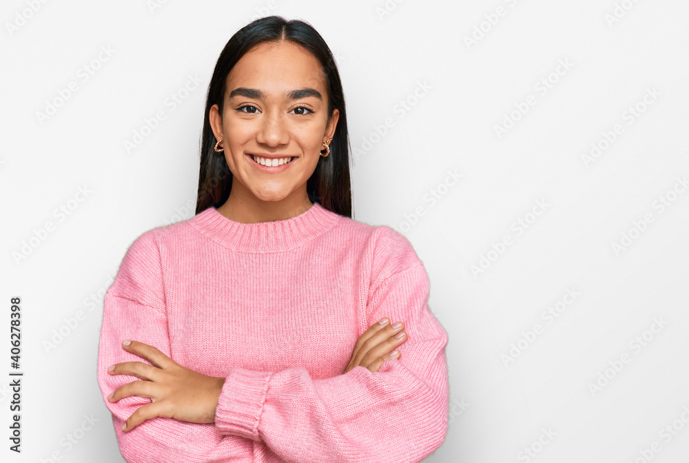 Young asian woman wearing casual winter sweater happy face smiling with crossed arms looking at the camera. positive person. Young asian woman wearing casual winter sweater happy face smiling with crossed arms looking at the camera. positive person.