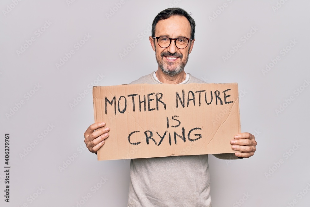 Middle age man asking for environment holding banner with mother nature is crying message looking positive and happy standing and smiling with a confident smile showing teeth Middle age man asking for environment holding banner with mother nature is crying message looking positive and happy standing and smiling with a confident smile showing teeth