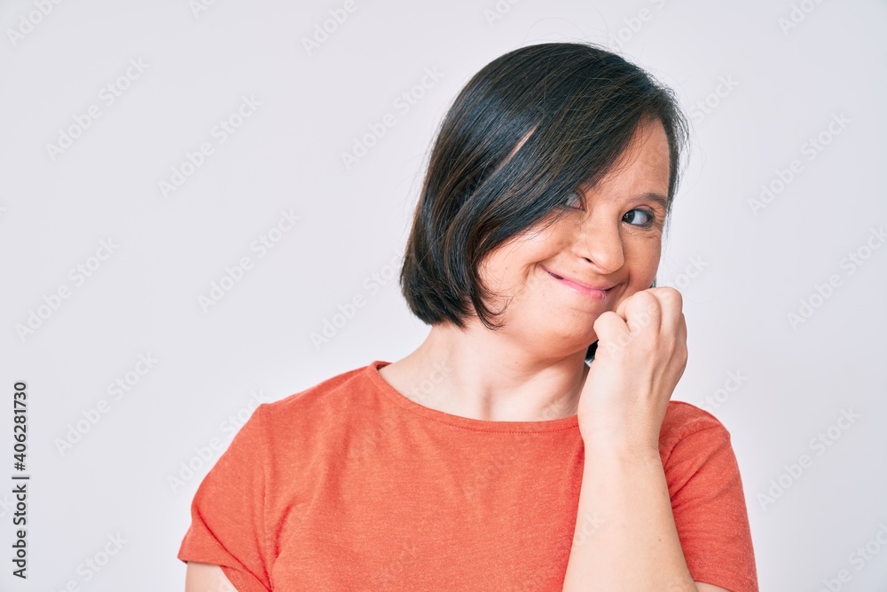 Brunette woman with down syndrome wearing casual clothes looking stressed and nervous with hands on mouth biting nails. anxiety problem. Brunette woman with down syndrome wearing casual clothes looking stressed and nervous with hands on mouth biting nails. anxiety problem.