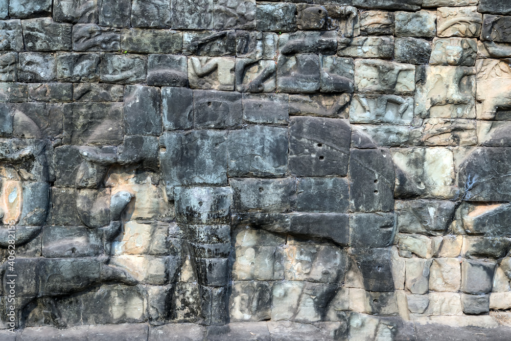 Fototapeta premium Old elephants art carvings Bas-relief on the wall in Angkor Wat