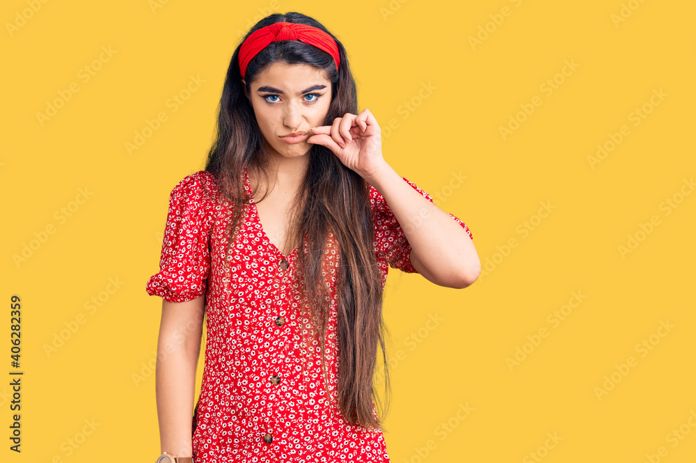 Brunette teenager girl wearing summer dress mouth and lips shut as zip with fingers. secret and silent, taboo talking Brunette teenager girl wearing summer dress mouth and lips shut as zip with fingers. secret and silent, taboo talking