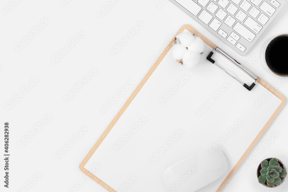 Minimal Office desk table top view with office supply and coffee cup on a white table with copy space, White color workplace composition, flat lay Minimal Office desk table top view with office supply and coffee cup on a white table with copy space, White color workplace composition, flat lay