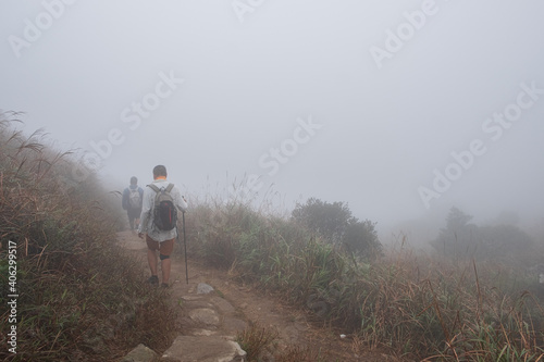 Hiking in the mist in the vicinity of Lantau peak in Hong Kong © Danil Rogulin