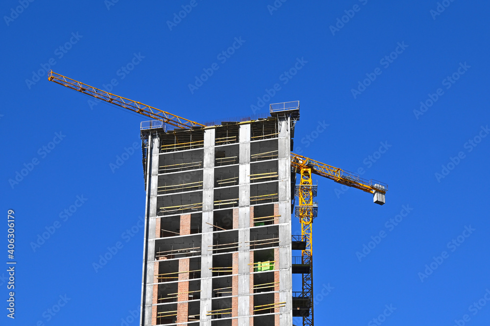 Crane and highrise construction site Crane and highrise construction site