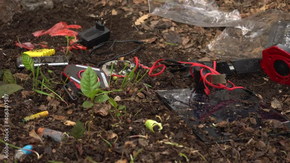 E-waste in a landfill. Electronic pollution. The environmental concern. Electrical and electronic equipment scrap and toxic components. Hazardous waste. Soil and water pollution by heavy metals