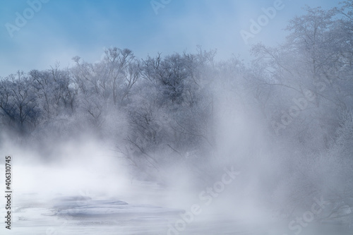 frost trees in the fog over the river in hokkaido japan