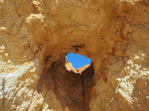 Praia da Vau with a cave with a hole to the sky in Portimao at the Algarve coast of Portugal