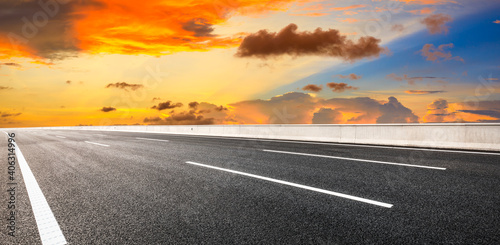 Asphalt road and sky clouds at sunset.Road background.