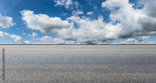 Empty asphalt road and blue sky with white clouds.Road background. © ABCDstock