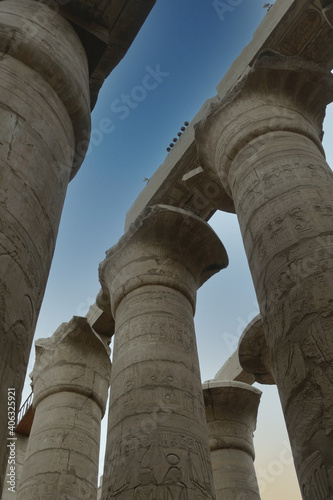 Low angle shot of columns with hieroglyphics in the Karnak temple in Egypt photo