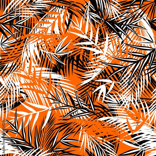 Seamless orange background with black and white coconut and fan-leaved palm leaves. Tropical print for fashion textile and wallpaper © Eva105