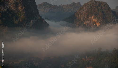 Mountain views and mist flowing through the gorge,. Mea Usu Cave, Tak in Thailand. photo