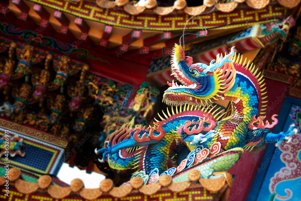 Traditional Chinese Ceramic dragon sculpture on temple roof