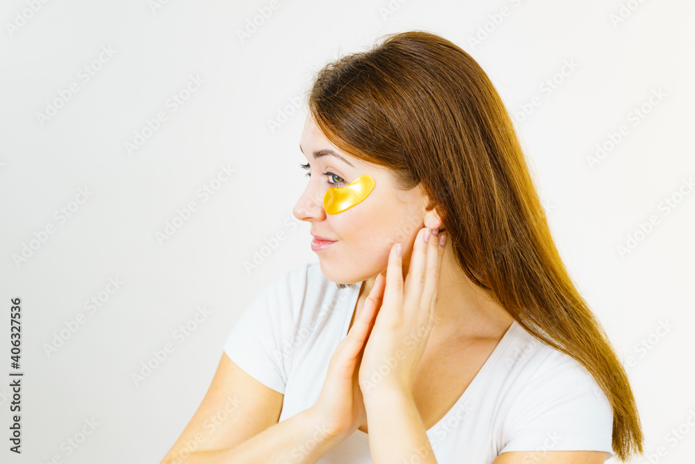 Woman with gold patches under eyes Woman with gold patches under eyes