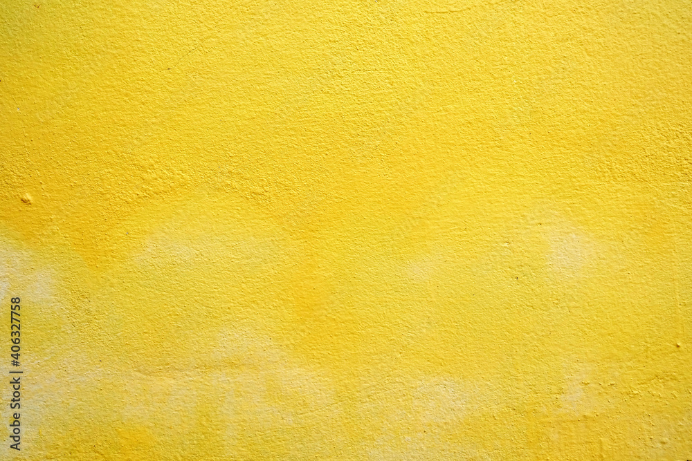 Fototapeta premium Yellow Painting on Concrete Wall Background, Suitable for Construction and Architecture Concept.
