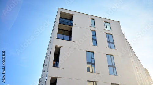 Fragment of modern luxury residential apartment,  home house building concept. Modern apartment building on a sunny day with a blue sky. © Grand Warszawski