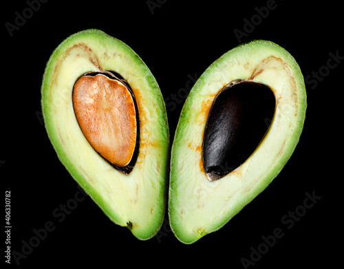 Avocado cut section macro shot isolated on black background