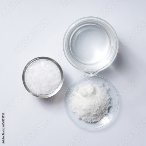 Cosmetic chemicals ingredient on laboratory table. Microcrystalline wax, Potassium chloride (KCl).