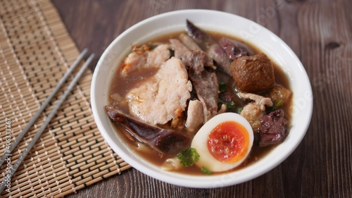 Noodle roll soup (Paste of rice flour) with pork and boiled egg