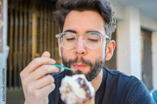 Young man eating ice cream