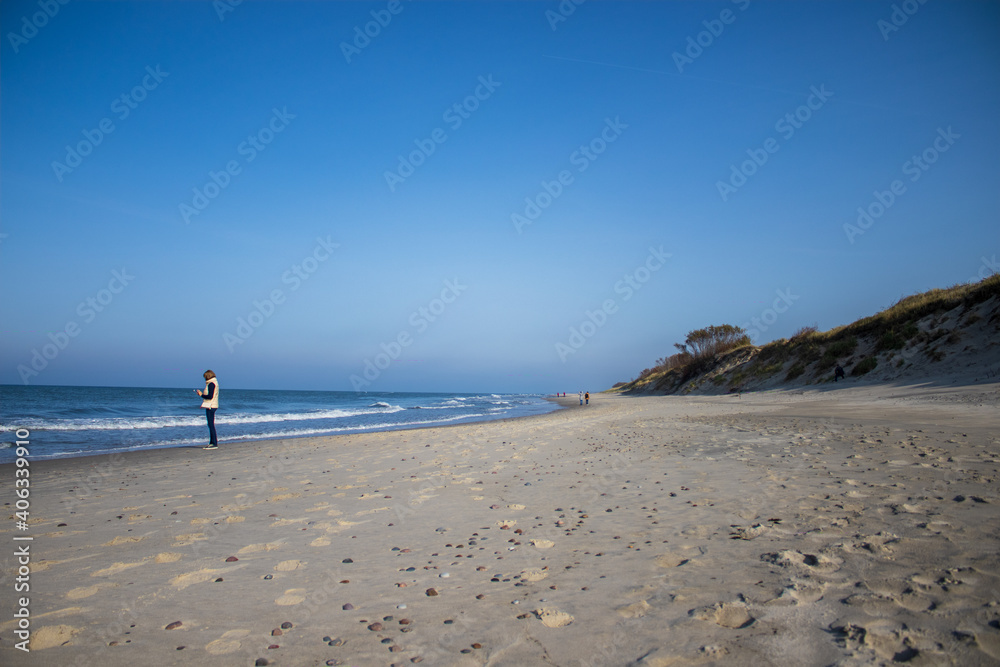 person walking on the beach