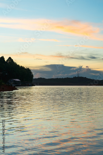 Golden hour sunrise in Kenyir Lake, Terengganu, Malaysia.