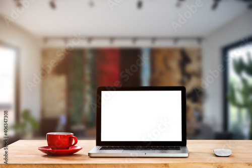 Workplace with notebook laptop and coffee cup Comfortable work table in cafe.